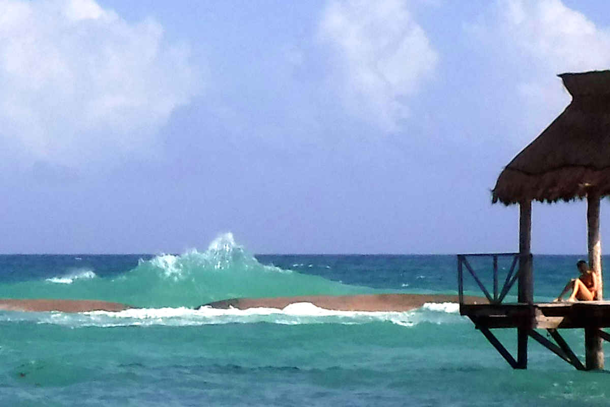 Waves hitting the new breakwater structures placed in the water to improve swimming conditions just off the beach.